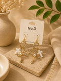 Cross charm earrings