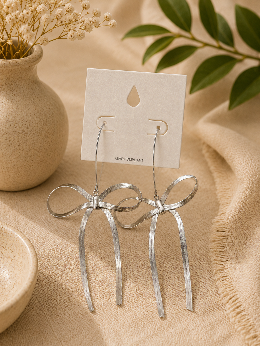 Silver bow earrings
